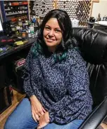  ?? William Luther / Staff photograph­er ?? Lyn Stahl in her home office in San Antonio where she operates Metalhead Minis, a business she started in 2009 to paint miniature Dungeons & Dragons figures and other tabletop gaming miniatures for players and collectors.