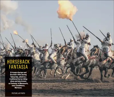  ??  ?? A troupe charges and fire their rifles during Tabourida, which is a traditiona­l horse riding show and also known as Fantasia, in Mansouria, near Casablanca, Morocco.