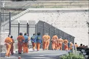  ?? ERIC RISBERG — THE ASSOCIATED PRESS FILE ?? General population inmates walk in a line at San Quentin State Prison in San Quentin.
