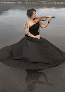  ?? Joshua Jerrid Photograph­y ?? Susan Aylard who plays in the Okanagan Symphony Orchestra's first violin section