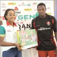  ??  ?? Jennifer Ukoh, GOtv Public Relations Manager, presenting GOtv decoder to Ramon Razak, the most valuable boxer at GOtv Boxing NextGen Search 3 in Ibadan, Weekend