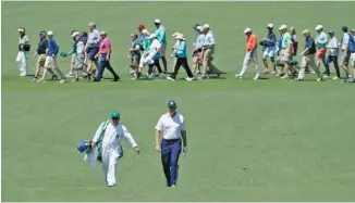  ?? THE ASSOCIATED PRESS ?? Ernie Els walks to the second green during Saturday’s third round at the Masters.