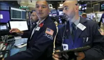  ?? RICHARD DREW — THE ASSOCIATED PRESS FILE ?? In this Friday, July 19 2019, file photo specialist Mark Otto, left, and trader Fred DeMarco work on the floor of the New York Stock Exchange. The U.S. stock market opens at 9:30 a.m. EDT on Friday, July 26.