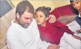 ??  ?? Rahul Gandhi in conversati­on with a boy in Amethi on Thursday.