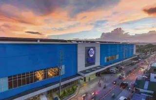  ??  ?? SM Center Tuguegarao's rhythmic blue facade energizes the main thoroughfa­re, and provides a delightful, genuine, and rewarding experience for all who visit the mall.