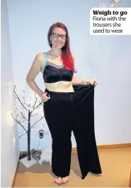  ??  ?? Weigh to go Fiona with the trousers she used to wear