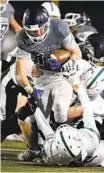  ?? DENIS POROY ?? San Marcos’ Kaden Vohnout tries to break the tackle of Coronado’s Elias Valdivia on a run during the first half.