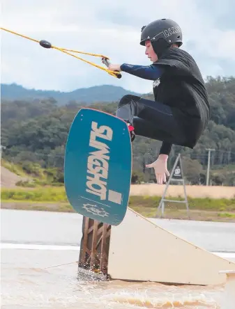  ?? Picture: RICHARD GOSLING ?? Taylor Watkins catches some air at Gold Coast Wake Park.