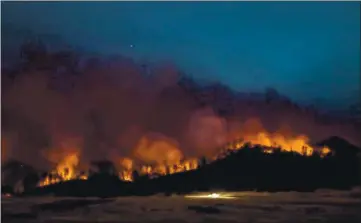  ?? FILE PHOTO — LAKE COUNTY PUBLISHING ?? The LNU Lightning Complex Fire as seen from Snell Valley Road south of Lake County. A recent study found Between Aug. 1 and Sept. 10, the historical­ly bad concentrat­ions of wildfire smoke were responsibl­e for at least 1,200 and possibly up to 3,000 deaths in California.