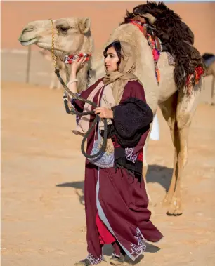  ?? Supplied photo ?? Fatima preparing for the Camel Trek on the first day of the 11-day journey. —