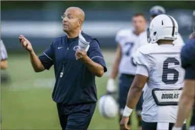  ?? JOE HERMITT — PENNLIVE.COM VIA AP ?? Penn State coach James Franklin talks to the team during NCAA college football practice Wednesday in State College, Pa.