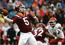  ?? PATRICK SEMANSKY/ASSOCIATED PRESS FILE ?? Virginia Tech’s Ryan Willis throws a pass during the Military Bowl loss to Cincinnati.