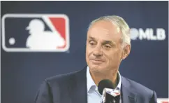  ?? CHARLIE NEIBERGALL / THE ASSOCIATED PRESS ?? Major League Baseball commission­er Rob Manfred speaks to the media on Thursday in Tampa, Fla. Manfred said umpires will crack down on obstructio­n to make base-running safer.