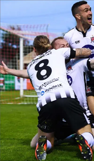  ??  ?? Chris Shields celebrates with teammates John Mountney and Michael Duffy after scoring the decisive goal in last