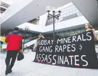  ?? NATHAN DENETTE / THE CANADIAN PRESS FILES ?? Protesters demonstrat­e in 2012 outside the HudBay
Minerals Inc. annual general meeting in Toronto.