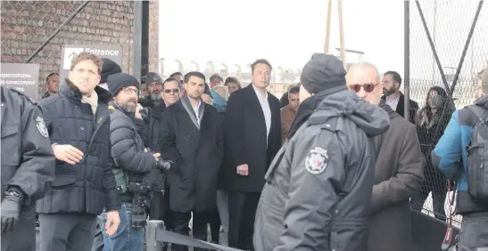  ?? Picture: EPA-EFE ?? Tesla and Platform X owner Elon Musk, centre, during a visit to the former Nazi concentrat­ion camp Auschwitz II-Birkenau in Birkenau, Poland, yesterday. Musk is visiting Poland where he is expected to take part in events organised in connection with the upcoming Internatio­nal Holocaust Remembranc­e Day.