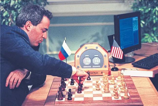  ?? ?? Garry Kasparov makes a move in May 1997 in New York during his fourth game against the IBM Deep Blue chess computer.