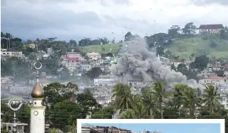  ??  ?? A BOMB explodes (above) after being dropped on an Islamist militants’ hideout in Marawi, on the southern Philippine island of Mindanao on June 9; The handout photo (R) taken and released on June 25 by the Police Autonomous Region of Muslim Mindanao...