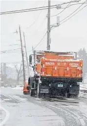  ?? Patrick Sikes/For Hearst Connecticu­t Media ?? A state plow truck passes by in Westport, Conn., Tuesday, Feb. 28.