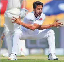  ?? AFP ?? Pakistan’s Hasan Ali celebrates after dismissing New Zealand’s Jeet Raval during the third day in Abu Dhabi.