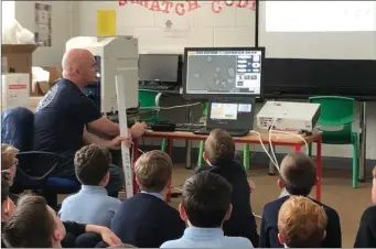  ??  ?? Tom Kearney with the boys in Donacarney school