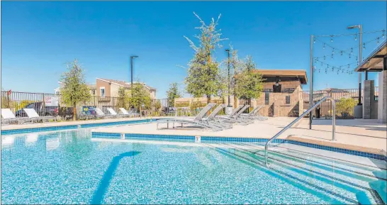  ?? Pardee Homes ?? Pardee Homes recently added a resident-exclusive swimming pool to the Evolve collection of upscale town homes in southwest Las Vegas.