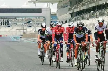  ?? Courtesy: Organisers ?? Alberto Contador trains with other riders ahead of the Abu Dhabi Tour at the Yas Marina Circuit yesterday. The cooler climes this year will be a major relief for the riders.