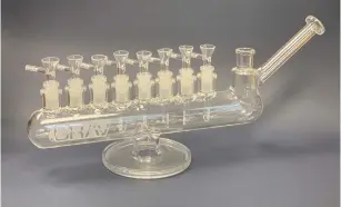  ?? (YIVO) ?? A GLASS BONG in the shape of a menorah is featured in ‘Am Yisrael High: The Story of Jews and Cannabis.’