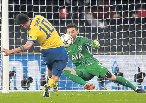  ?? Picture: PA. ?? Juventus’ Paulo Dybala scores the goal at Wembley that put Spurs out of the Uefa Champions League.