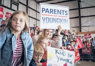  ?? CARLOS BERNATE/THE NEW YORK TIMES ?? People attend a campaign event for Glenn Youngkin on Monday in Chesterfie­ld, Virginia.