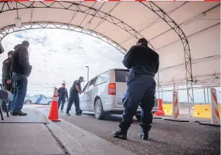  ?? ROBERTO E. ROSALES/JOURNAL ?? Customs and Border Protection agents check a van headed into Mexico at the Port of Entry in Columbus, N.M.