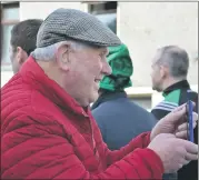  ?? Ahern) (Pic: John ?? SOCIAL MEDIA MAN IN ACTION: Jim Fitzgerald, from Galbally, busy videoing for his online page at last Sunday’s parade in Ballylande­rs.
