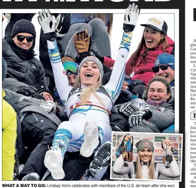  ?? Reuters (2) ?? WHAT A WAY TO GO: Lindsey Vonn celebrates with members of the U.S. ski team afterfter she won bronze in the world championsh­ip downhill Sunday in her final career race.