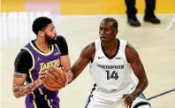  ?? Meg Oliphant / Getty Images ?? Gorgui Dieng (14) is in his eighth season and averages nearly eight points and just more than six rebounds per game.