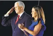  ?? Andrew Harnik Associated Press ?? VICE PRESIDENT Mike Pence, with wife Karen, noted the storm but elided over other national crises.