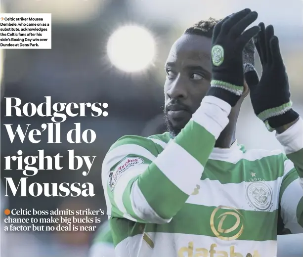  ??  ?? 3 Celtic striker Moussa Dembele, who came on as a substitute, acknowledg­es the Celtic fans after his side’s Boxing Day win over Dundee at Dens Park.