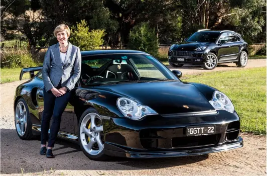  ??  ?? Black magic duo. Ingrid with her ‘baby’ 996 GT2 Clubsport and in the background, her daily Macan