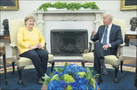  ?? EVAN VUCCI — THE ASSOCIATED PRESS ?? President Joe Biden meets with German Chancellor Angela Merkel in the Oval Office of the White House, Thursday, July 15in Washington.