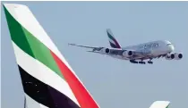  ?? AP PHOTO ?? SOARING
An Emirates Airbus A380 jumbo jet lands at Dubai Internatio­nal Airport in Dubai, United Arab Emirates on Sept. 9, 2022. Emirates announced on May 13, 2024 record annual profits of $5.1 billion on the back of strong customer demand.