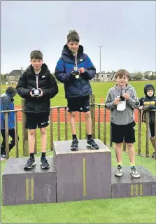  ?? ?? Individual race winners, overall league winners and fastest P7 boys’ team - Reece Popplewell (gold). Harry Popplewell (silver) and Charlie Gilmore (bronze).