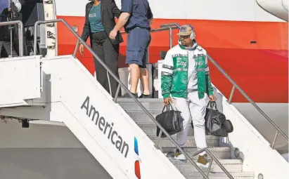  ?? MICHAEL CHOW/USA TODAY SPORTS ?? Jalen Hurts deplanes after arriving at Goldwater Air National Guard Base in Phoenix. The Eagles went 14-1 in his starts at quarterbac­k in 2022.