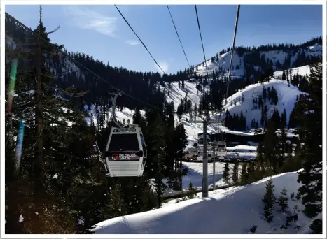  ?? PHOTO BY DINO VOURNAS ?? The new Base to Base Gondola at Tahoe's Palisades Tahoe Resort approaches the Alpine base area, originatin­g from the Olympic Valley base station. The gondola merged the two resorts last season — which was a monumental snow event — to form the largest ski area in California.