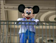  ?? AP FILE ?? Mickey Mouse greets visitors at the entrance to Magic Kingdom Park at Walt Disney World Resort, April 18, 2022.