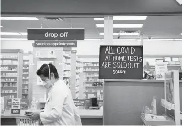  ?? ?? A CVS store sign alerts customers the store is out of at-home COVID-19 tests in Atlanta.