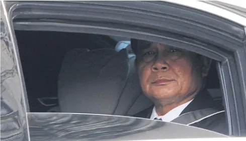  ?? THITI WANNAMONTH­A ?? Prime Minister Prayut Chan-o-cha looks at the press corps from his car. Once regarded as a consolidat­ing democracy, Thailand under his leadership has degenerate­d into a full-blown military dictatorsh­ip.