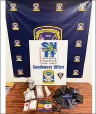  ?? Norwalk Police Department / Facebook ?? Two people were arrested Wednesday after multiple searches turned up drugs, fake IDs, narcotics parapherna­lia and other illegal items, according to Norwalk police.