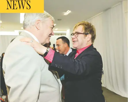  ?? GEORGE PIMENTEL / WIREIMAGE FILES ?? Sir Elton John, who has called Conrad Black “deeply loyal,” greets Black at a Toronto appearance in September 2012. U.S. President
Donald Trump cited John’s support, along with that from Rush Limbaugh and Henry Kissinger, as contributi­ng to the decision.