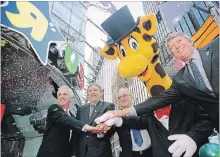  ?? BLOOMBERG FILE PHOTO ?? Toys "R" Us founder Charles Lazarus, is shown second from right at the 2001 grand opening of the new store in New York's Times Square.