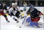  ?? ADAM HUNGER — THE ASSOCIATED PRESS ?? Rangers goalie Henrik Lundqvist clears the puck during the third period of Saturday’s game.