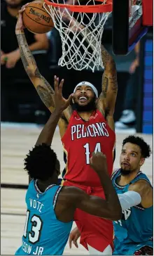  ?? (AP/Ashley Landis) ?? Brandon Ingram (center) led the New Orleans Pelicans with 24 points in a 109-99 victory over the Memphis Grizzlies on Monday night.